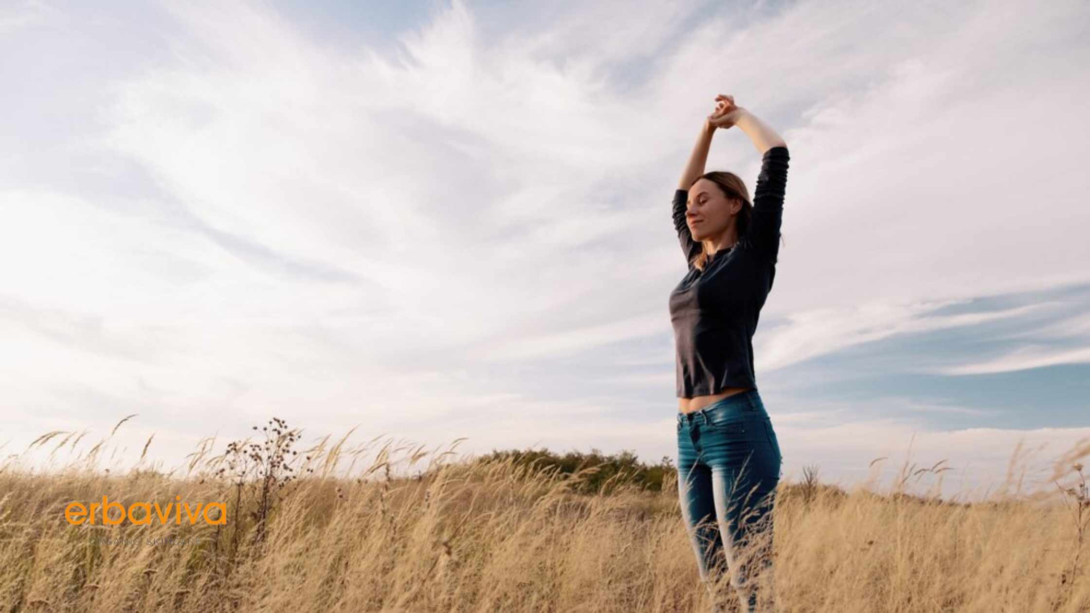 Woman confidently raise her hands using natural-oragnic deodorant by erbaviva