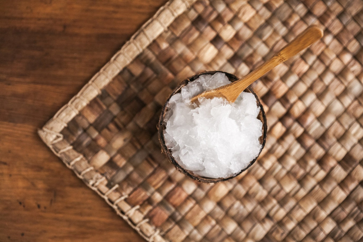coconut oil in a wooden cup